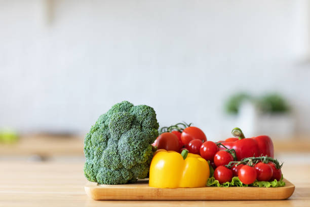 istock Vegetables on a cutting board in the kitchen. 1317382193