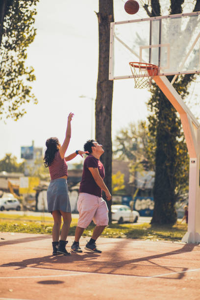 istock Young happy  couple playing basketball. 1317382418