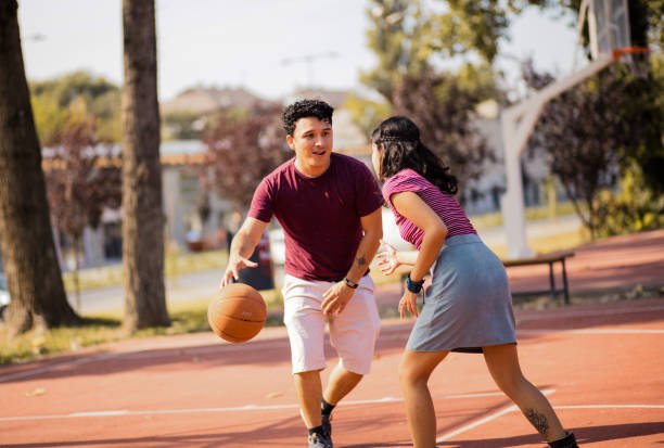 istock Young happy  couple playing basketball. 1317382438