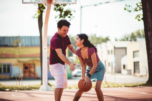 istock Young happy  couple playing basketball. 1317382517