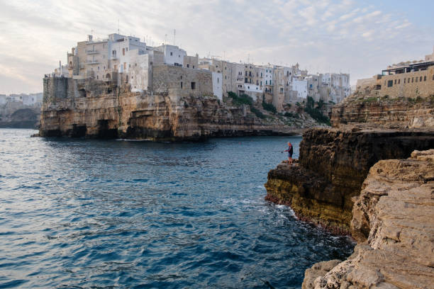 istock City on the rocky seashore. Cloudy morning 1317383355