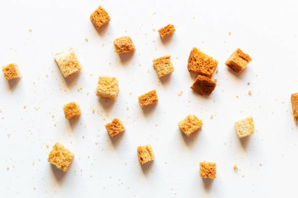 istock crumbs of roasted white bread on a white background closeup 1317384604