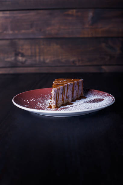 istock sweet dessert cake on a plate, beautiful serving, dark background 1317386675