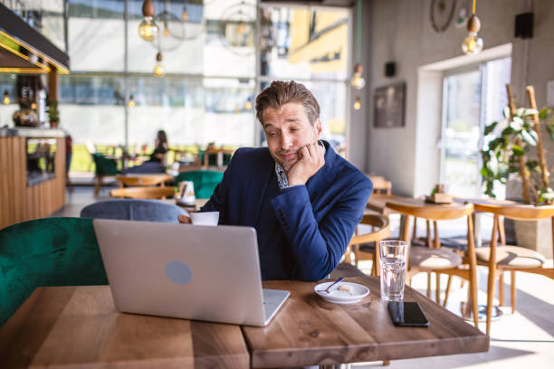 istock Business man in a cafe 1317386746