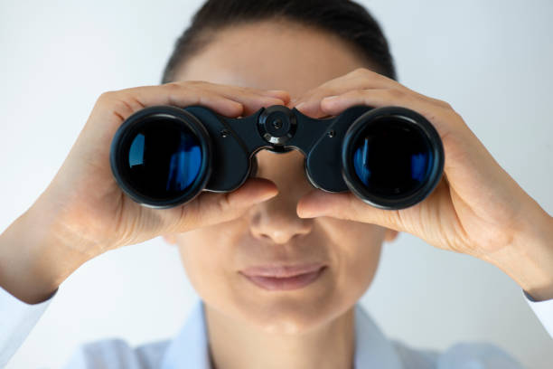 istock Businesswoman With Binoculars 1317387782