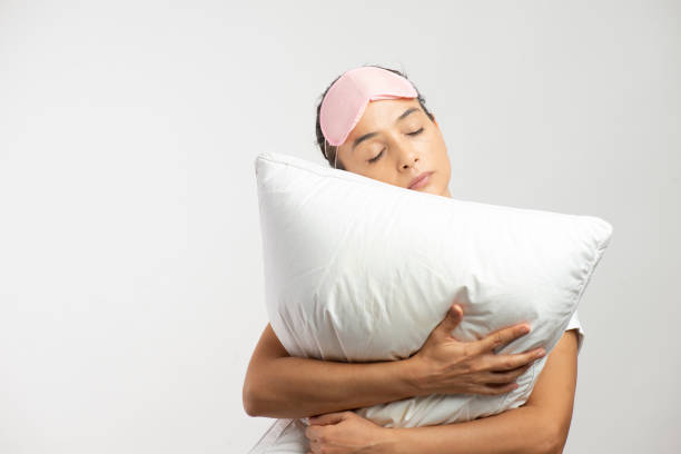 istock Happy Woman Embracing Pillow 1317388582