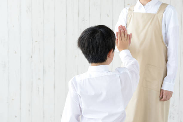 istock Child giving haigh five with mother 1317390791