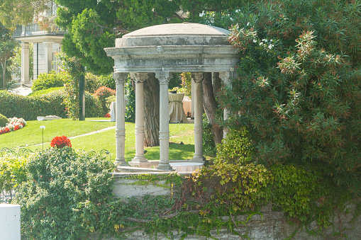 A gazebo on the grounds of a hotel or private villa on Lake Como in Lombardy, Italy