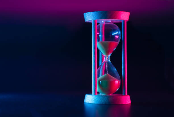 istock Passage of time. Hourglass on a dark background. 1317397364