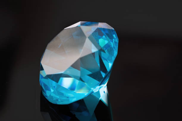istock Brilliant or diamond gem on black background. 1317397381