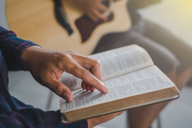 istock young prayer reading Holy Bible and worship god 1317397785