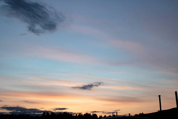 istock Blue and pink clouds in the evening sky 1317402104