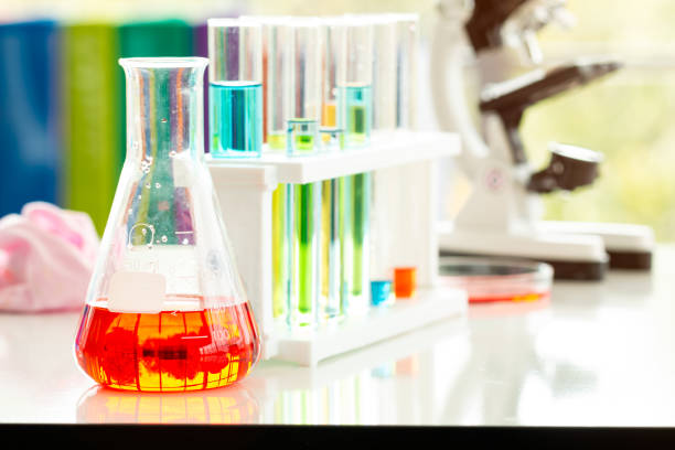 istock Close up Glassware with red liquid inside with test tubes and microscope in laboratory 1317402218