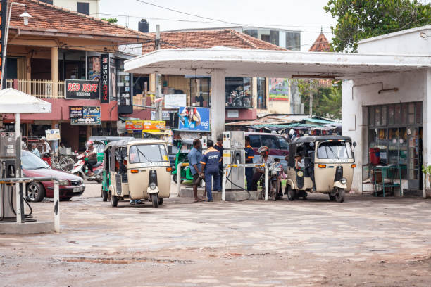 Gas station in Negombo Sri Lanka Colombo, Sri Lanka - September 29, 2009:a gas station with two Tuktuk on refuel on the road from Colombo to Negombo taxi sri lanka stock pictures, royalty-free photos & images