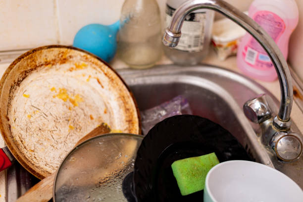 istock Dirty dishes in the kitchen sink. 1317403824