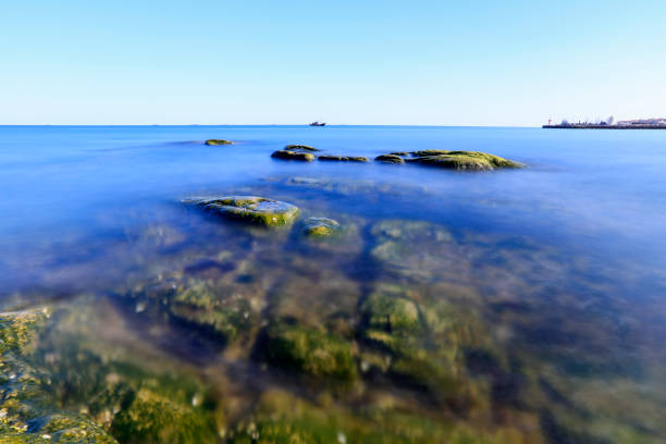 Seaside scenery, the sea under the blue sky, the rocks on the sea.
