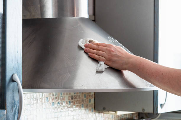 istock female hand washes stainless steel kitchen hood 1317405656