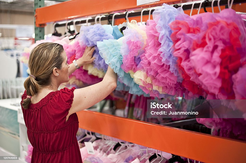 shopping for clothes stock photo woman buying clothes at a department store 40-44 Years Stock Photo