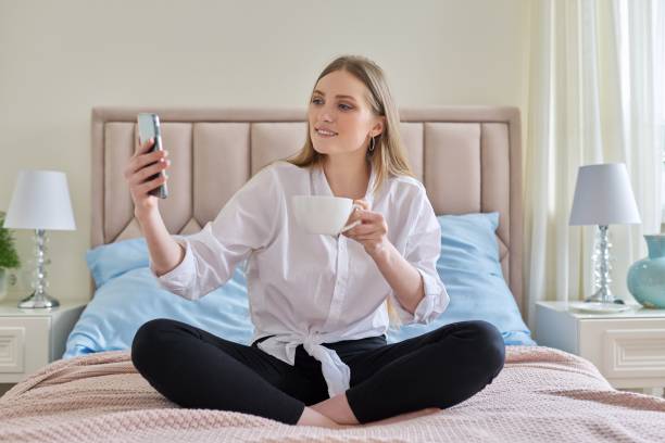 istock Happy talking young woman using video communication on smartphone 1317411256