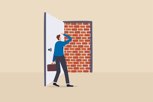 Business dead end, no way to exit or big mistake and wrong decision, obstacle and difficulty to overcome concept, businessman open exit door and found brick wall blocking the way.
