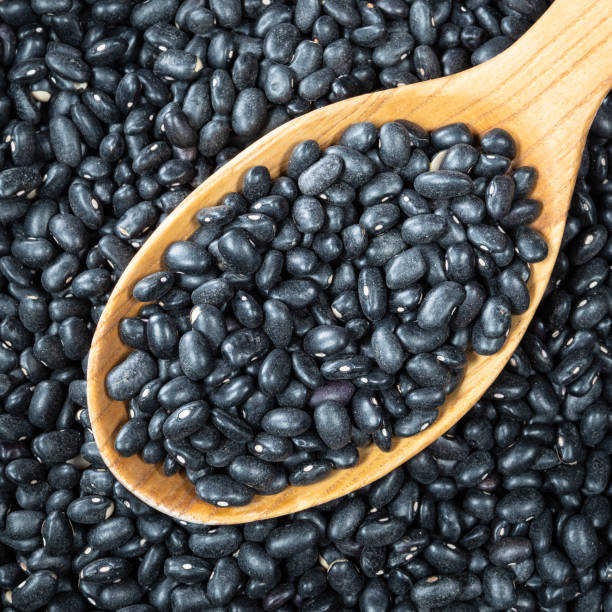 istock black turtle beans in wooden spoon closeup 1317411539