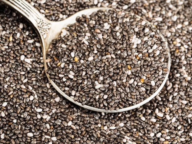 チア種子の銀大さじ - tablespoon chia healthy eating seed ストックフォトと画像