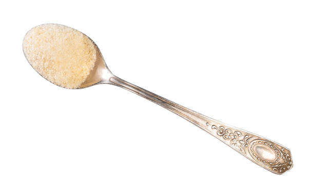 crystalline beef gelatine in silver spoon cutout top view of crystalline beef gelatine in silver spoon cutout on white background tsp stock pictures, royalty-free photos & images