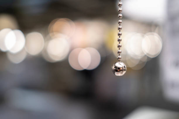 reflective pendant in lens flare background