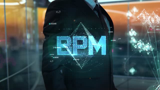 Businessman with BPM hologram concept