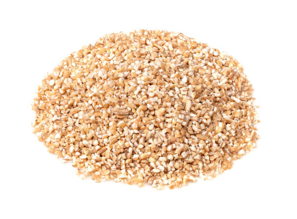 istock handful of crushed wheat groats closeup on white 1317416037