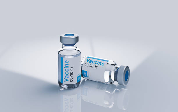istock Two ampoules vaccine from coronavirus 3d render illustration on white. 1317418335