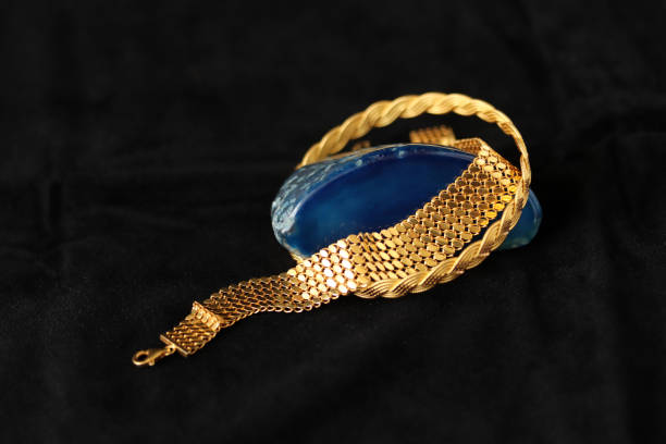 istock blue agate stone and gold bracelets 1317419786