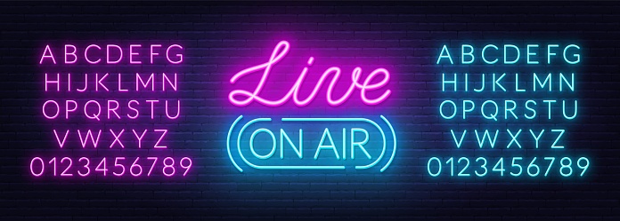 Live on air neon sign on a brick wall background. Pink and blue neon alphabets.