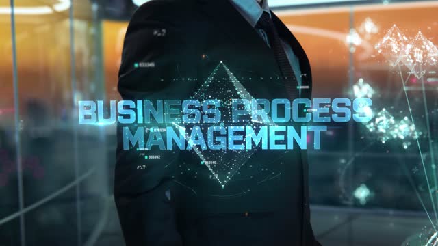 Businessman with Business Process Management hologram concept
