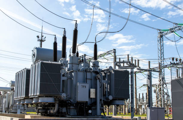 High voltage power transformer High voltage transformer against the blue sky. Electric current redistribution substation electricity substation photos stock pictures, royalty-free photos & images