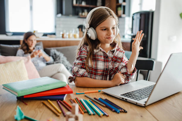 istock A little girl attends online classes at home 1317424600