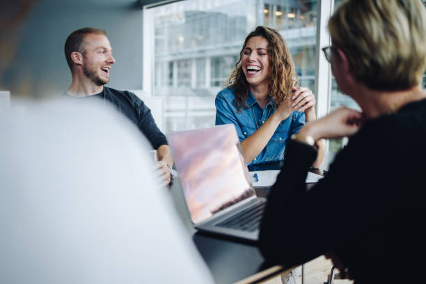 istock Smiling business team in boardroom meeting 1317425725