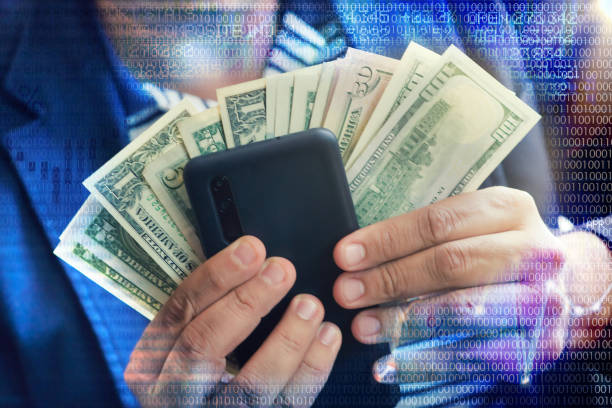 istock Make money online with smartphone or mobile device concept 1317426043