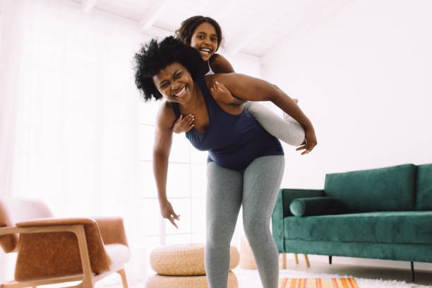 istock Grandmother piggybacking her granddaughter while exercising 1317426811