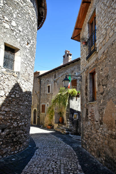 The old town of Sermoneta, Italy. Sermoneta, Italy, 05/10/2021. a narrow street between old stone buildings of a medieval town in the Lazio region. village lazio photography sermoneta stock pictures, royalty-free photos & images