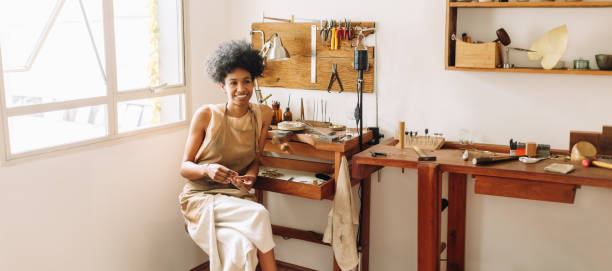 istock Worker sitting in jewelry workshop 1317426874