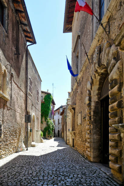 The old town of Sermoneta, Italy. Sermoneta, Italy, 05/10/2021. a narrow street between old stone buildings of a medieval town in the Lazio region. village lazio photography sermoneta stock pictures, royalty-free photos & images