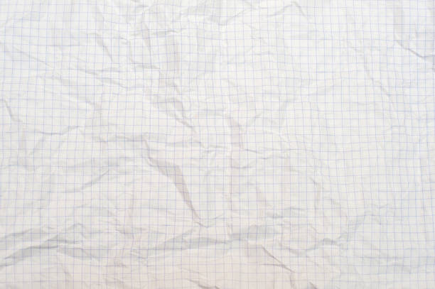 istock Texture of crumpled white paper in a cage, school notebook 1317427209