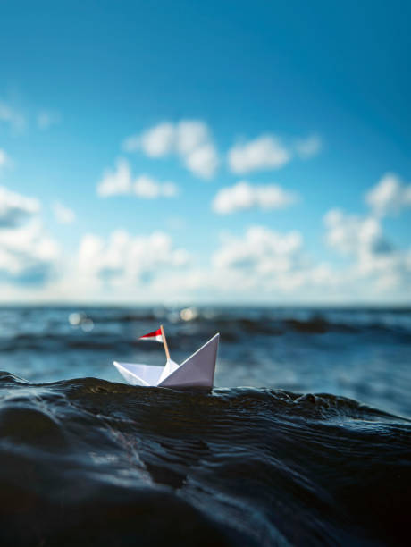 istock Paper boat sailing on big waves 1317428046