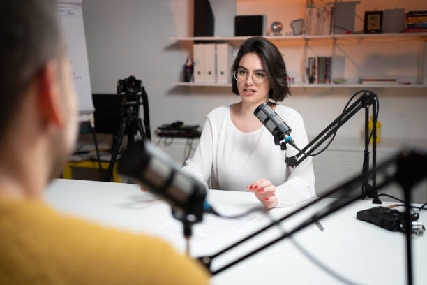 istock Young female presenter talking on a podcast 1317428706