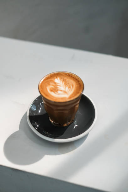 istock Cup of coffee latte in coffee shop 1317434174