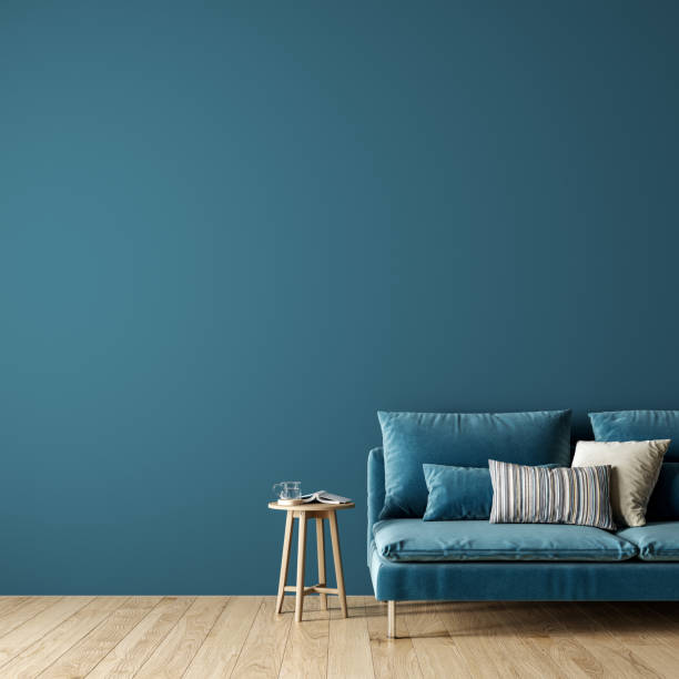 istock Modern interior design of living room with blue sofa and empty mock up wall background 1317437078