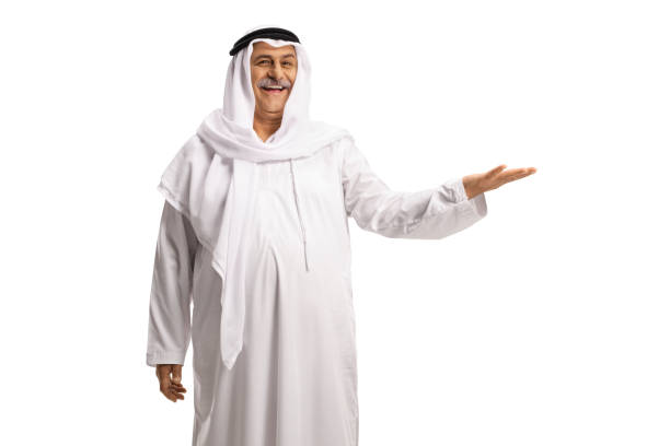 Mature muslim man in white dishdasha gesturing with hand Mature muslim man in white dishdasha gesturing with hand isolated on white background mullah photos stock pictures, royalty-free photos & images