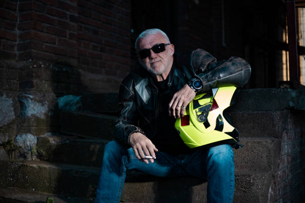istock Portrait of an older man holding a helmet while sitting. 1317440915