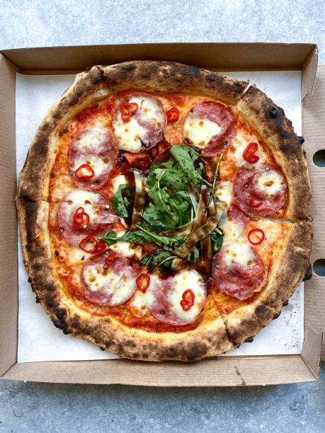 istock Take Away Tasty Pepperoni Pizza and Cooking Ingredients Basil. 1317449145